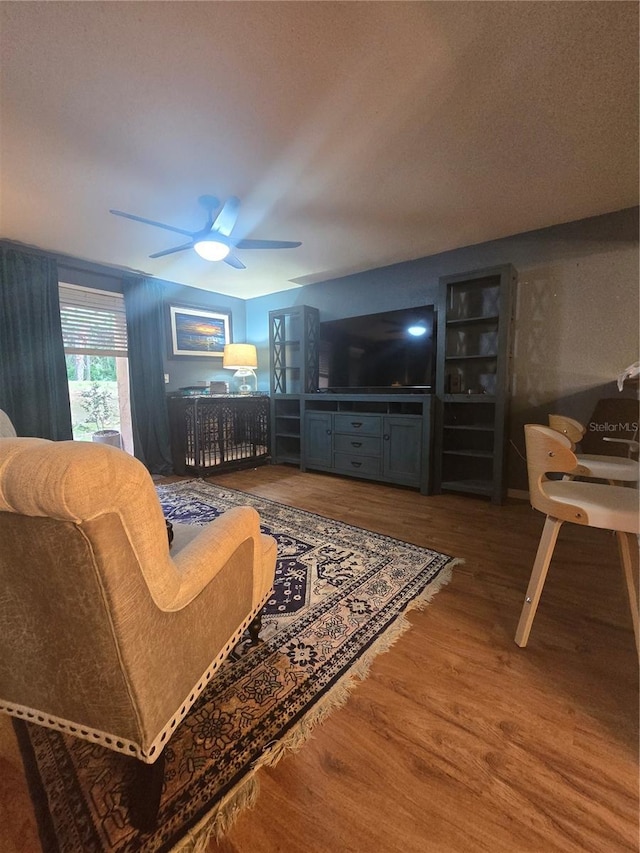 1810 NW 23rd Blvd Unit 230A, Gainesville, FL 32605 - living area with wood finished floors and a ceiling fan