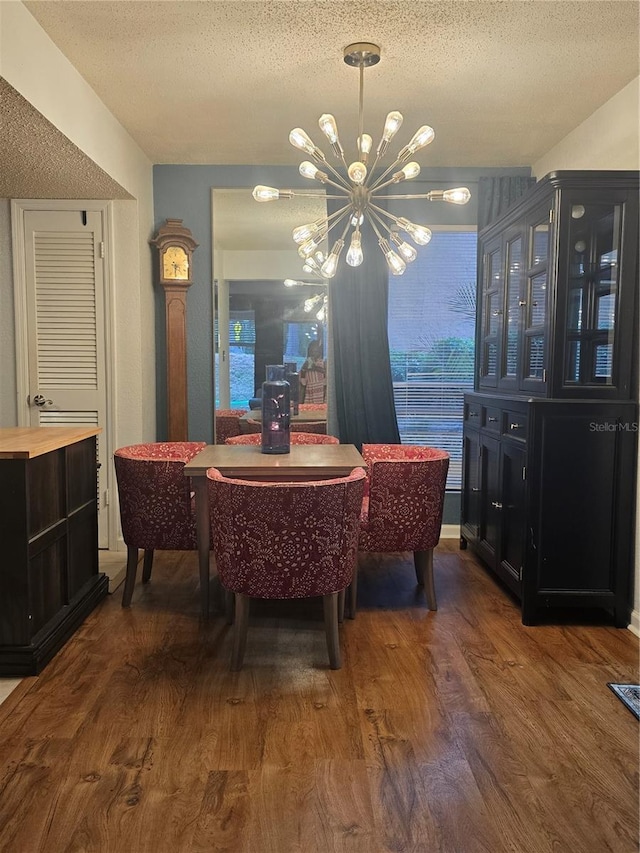 1810 NW 23rd Blvd Unit 230A, Gainesville, FL 32605 - dining space featuring a chandelier, a textured ceiling, and wood finished floors