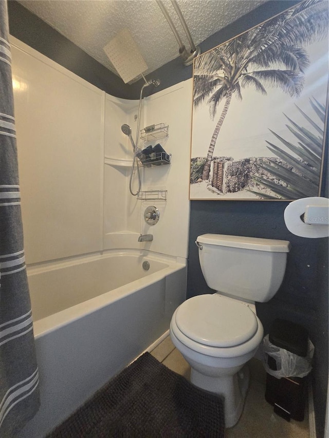 1810 NW 23rd Blvd Unit 230A, Gainesville, FL 32605 - bathroom featuring a textured ceiling, shower / bathtub combination with curtain, toilet, and tile patterned floors