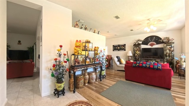 5340 NW 26th Ln, Ocala, FL 34482 - tiled living room with a ceiling fan
