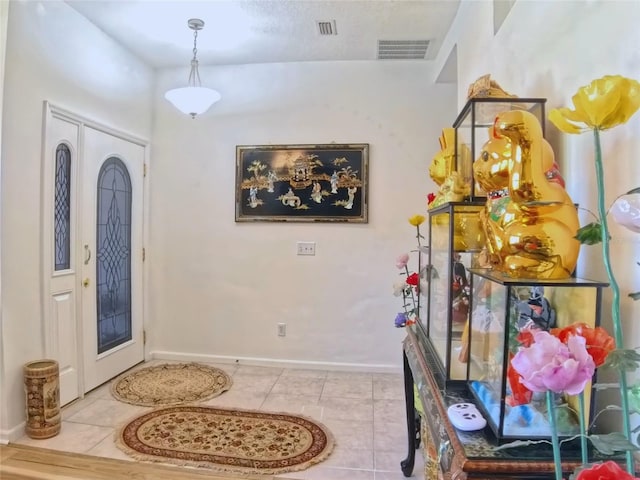 5340 NW 26th Ln, Ocala, FL 34482 - entryway with baseboards and tile patterned floors