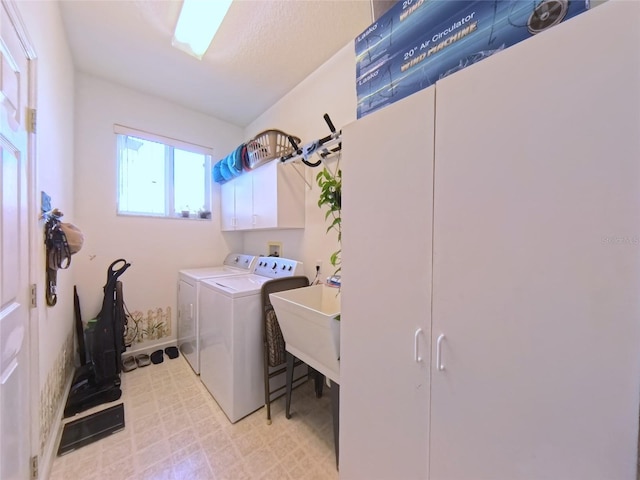 5340 NW 26th Ln, Ocala, FL 34482 - laundry room featuring cabinet space, separate washer and dryer, and light floors
