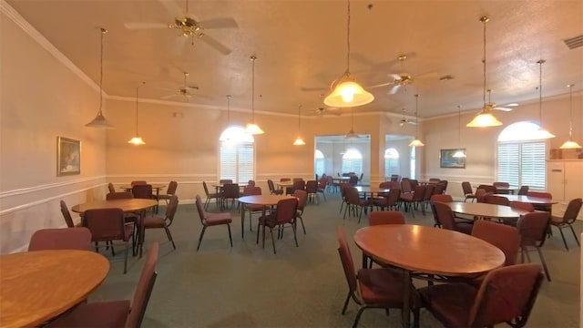 5340 NW 26th Ln, Ocala, FL 34482 - dining room with a high ceiling, ceiling fan, and wainscoting