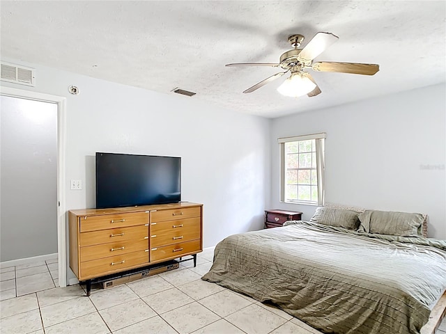 bedroom with light tile patterned floors and ceiling fan