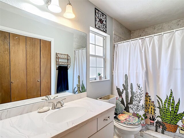 full bath with vanity, toilet, and a shower with shower curtain