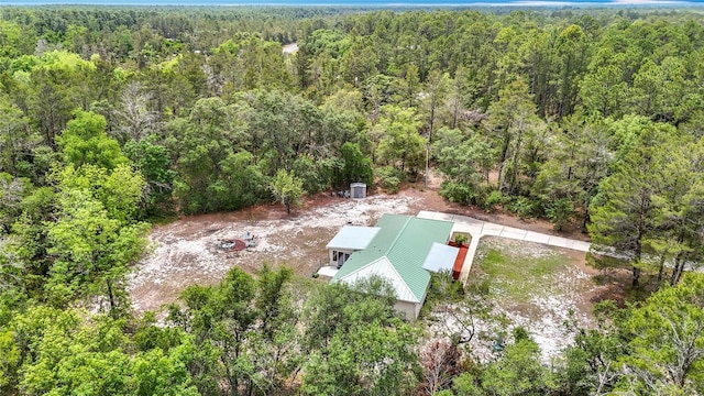 view of subject property featuring a forest