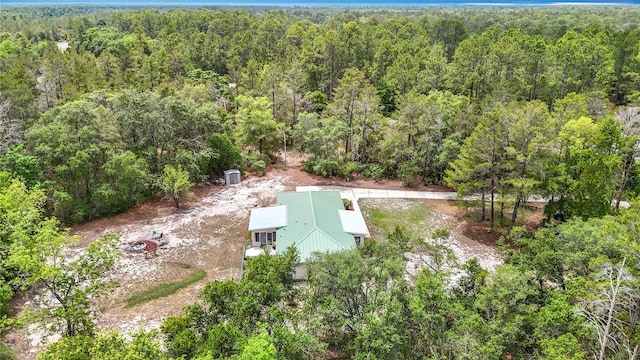 view from above of property with a forest