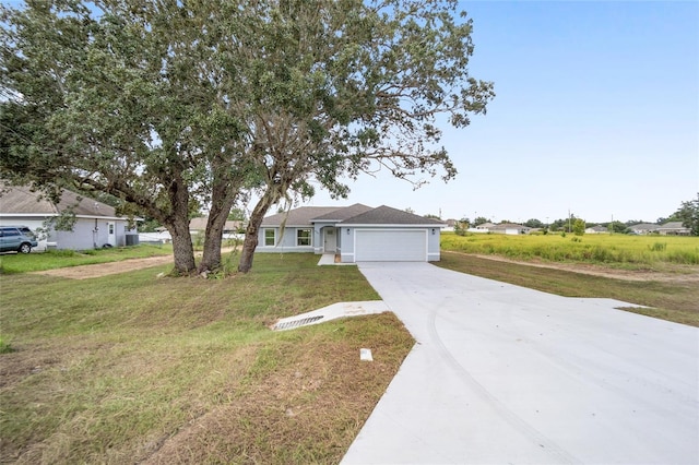 9731 Bahia Rd, Ocala, FL 34472 - view of front of property with a garage, driveway, and a front yard