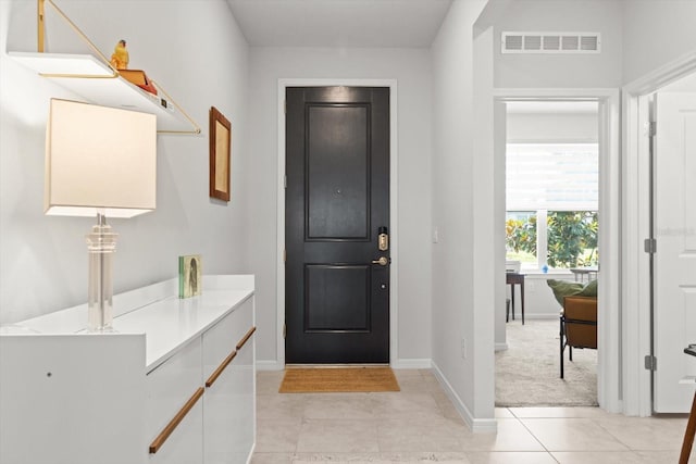 9459 SW 52nd Loop, Ocala, FL 34481 - foyer entrance with baseboards and light tile patterned flooring