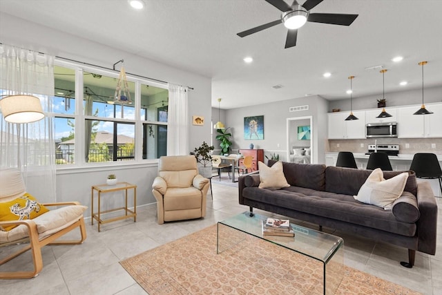 9459 SW 52nd Loop, Ocala, FL 34481 - living area with recessed lighting, ceiling fan, and light tile patterned flooring