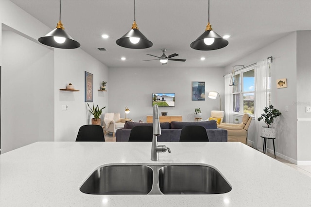 9459 SW 52nd Loop, Ocala, FL 34481 - kitchen with open floor plan, pendant lighting, a ceiling fan, and recessed lighting
