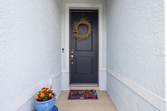 9459 SW 52nd Loop, Ocala, FL 34481 - doorway to property featuring stucco siding