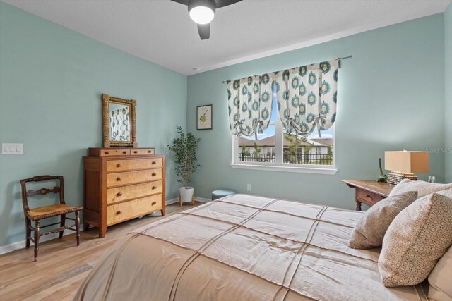 9459 SW 52nd Loop, Ocala, FL 34481 - bedroom featuring wood finished floors and ceiling fan