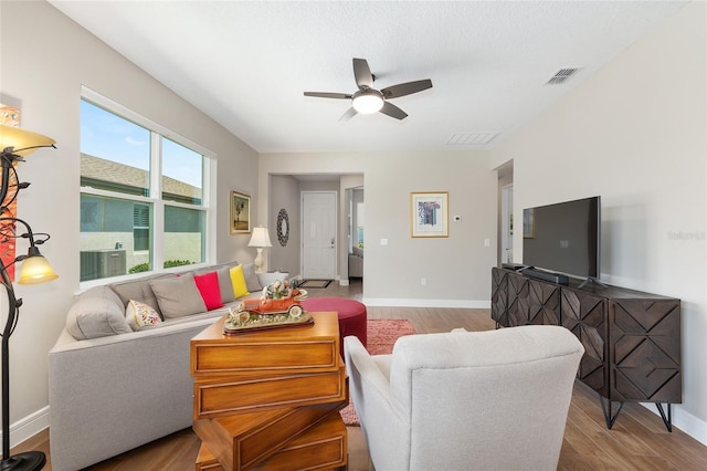 8820 SW 58th Street Rd, Ocala, FL 34481 - living area with wood finished floors, ceiling fan, and baseboards