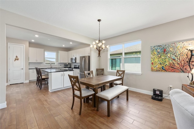 8820 SW 58th Street Rd, Ocala, FL 34481 - dining space with a chandelier, light wood finished floors, baseboards, and recessed lighting