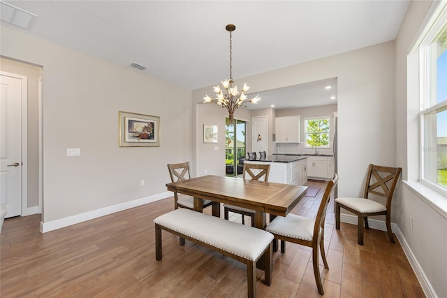 8820 SW 58th Street Rd, Ocala, FL 34481 - dining room featuring light wood-style flooring, a chandelier, baseboards, and recessed lighting