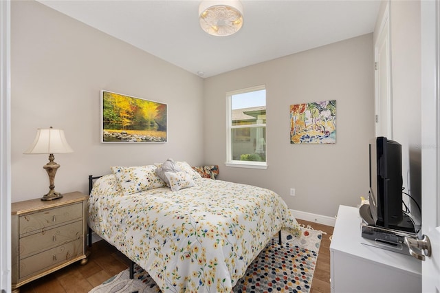 8820 SW 58th Street Rd, Ocala, FL 34481 - bedroom featuring dark wood-type flooring and baseboards
