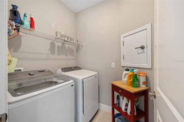 8820 SW 58th Street Rd, Ocala, FL 34481 - washroom with independent washer and dryer, light tile patterned floors, and baseboards
