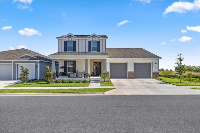 7199 SW 60th Ln, Ocala, FL 34474 - view of front facade featuring a porch, driveway, an attached garage, board and batten siding, and roof with shingles