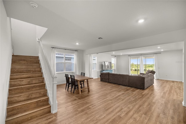 7199 SW 60th Ln, Ocala, FL 34474 - living area featuring light wood finished floors, stairway, recessed lighting, and baseboards