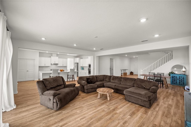 7199 SW 60th Ln, Ocala, FL 34474 - living room featuring light wood finished floors, stairs, and recessed lighting