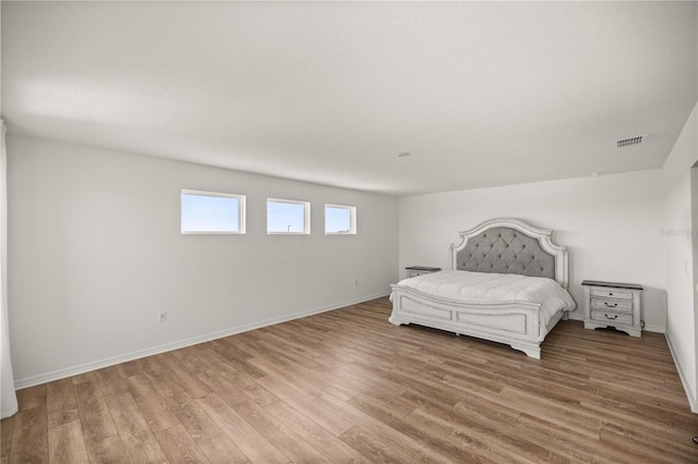 7199 SW 60th Ln, Ocala, FL 34474 - bedroom with wood finished floors and baseboards