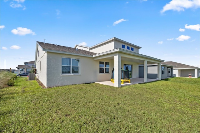 7199 SW 60th Ln, Ocala, FL 34474 - rear view of house featuring a patio area, stucco siding, a lawn, and cooling unit