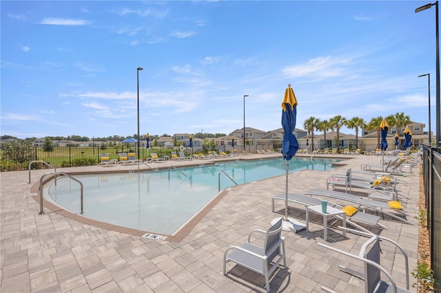 7199 SW 60th Ln, Ocala, FL 34474 - community pool with fence and a patio area