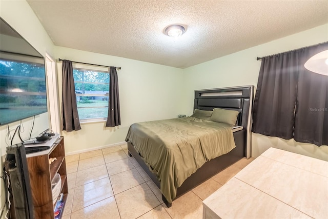 2140 NE 40th St, Ocala, FL 34479 - bedroom featuring a textured ceiling and light tile patterned floors