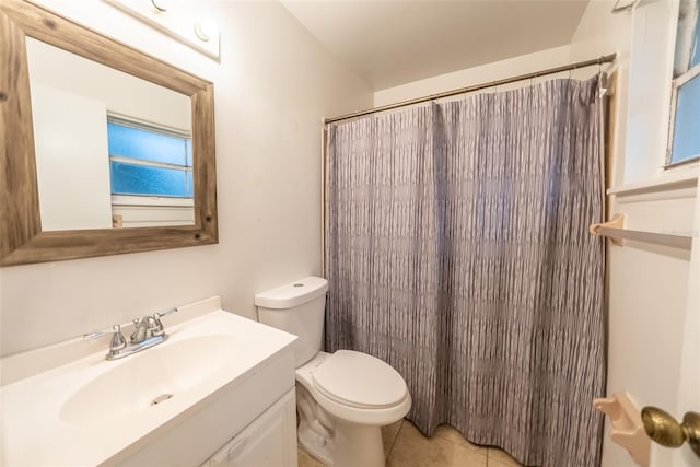 2140 NE 40th St, Ocala, FL 34479 - bathroom featuring toilet, vanity, curtained shower, and tile patterned floors