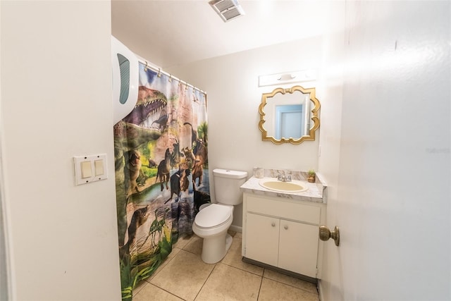 2140 NE 40th St, Ocala, FL 34479 - bathroom featuring toilet, tile patterned floors, vanity, and curtained shower