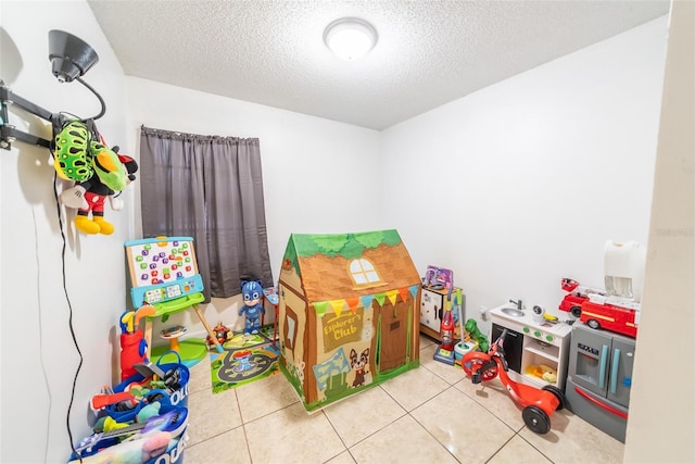 2140 NE 40th St, Ocala, FL 34479 - recreation room featuring tile patterned flooring and a textured ceiling