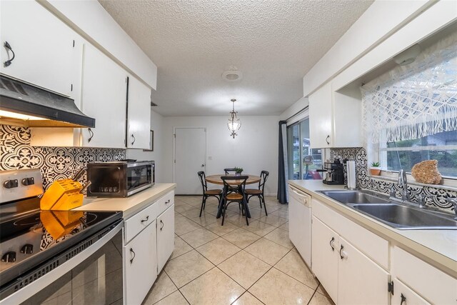2140 NE 40th St, Ocala, FL 34479 - kitchen featuring stainless steel range with electric cooktop, a sink, tasteful backsplash, light countertops, and dishwasher