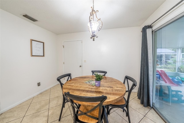 2140 NE 40th St, Ocala, FL 34479 - dining room with light tile patterned flooring and baseboards