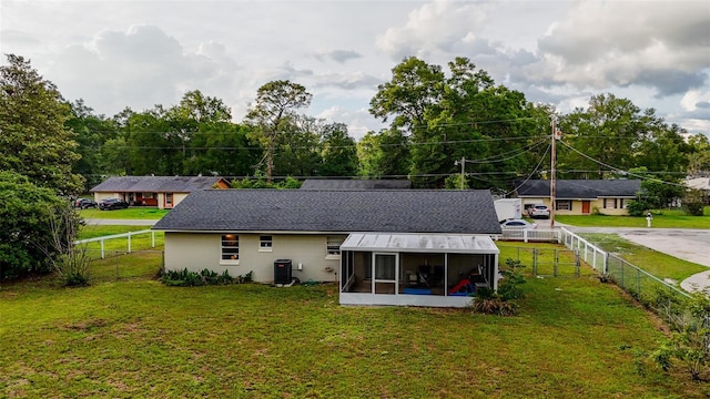 2140 NE 40th St, Ocala, FL 34479 - rear view of property featuring a sunroom and central air condition unit