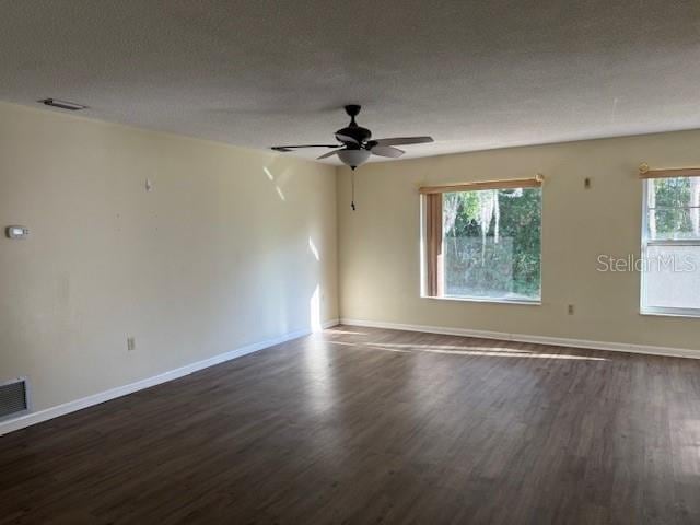 616 Water Rd, Ocala, FL 34472 - unfurnished room featuring dark wood-type flooring, baseboards, and ceiling fan