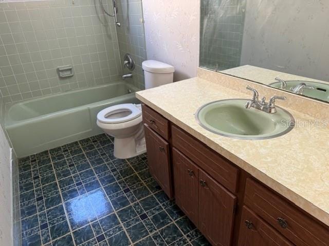 616 Water Rd, Ocala, FL 34472 - bathroom featuring vanity, toilet, shower / bath combination, and tile patterned floors