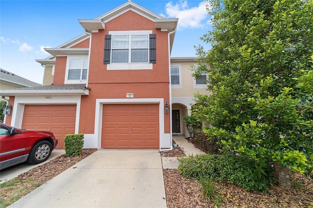4927 SW 45th Cir, Ocala, FL 34474 - multi unit property featuring concrete driveway, an attached garage, and stucco siding