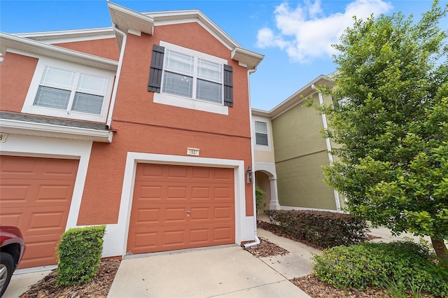 4927 SW 45th Cir, Ocala, FL 34474 - multi unit property featuring stucco siding, a garage, and driveway