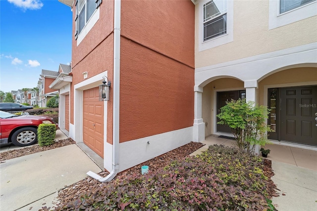 4927 SW 45th Cir, Ocala, FL 34474 - view of side of home with stucco siding and a garage