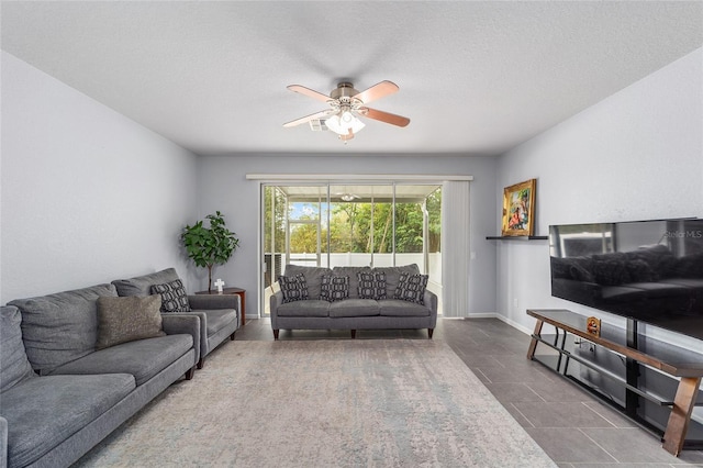 4927 SW 45th Cir, Ocala, FL 34474 - tiled living room with ceiling fan, baseboards, and a textured ceiling