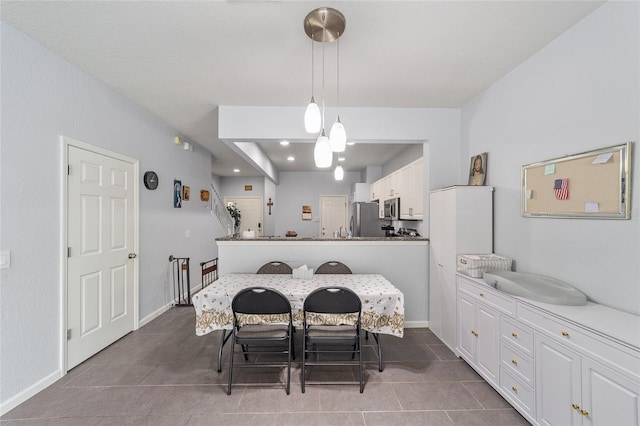 4927 SW 45th Cir, Ocala, FL 34474 - tiled dining area with baseboards