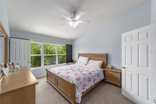4927 SW 45th Cir, Ocala, FL 34474 - bedroom with light colored carpet, vaulted ceiling, ceiling fan, and a textured ceiling