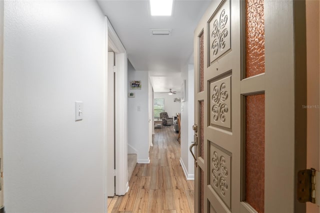 3815 NE 17th Street Cir, Ocala, FL 34470 - hallway featuring light wood-style floors and baseboards