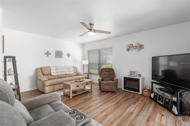 3815 NE 17th Street Cir, Ocala, FL 34470 - living area featuring a ceiling fan and light wood-type flooring