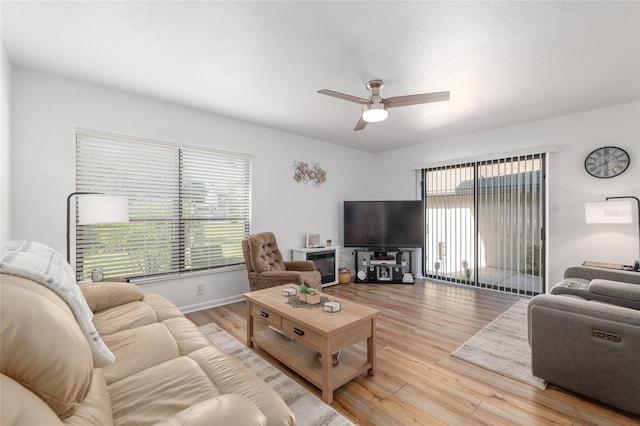 3815 NE 17th Street Cir, Ocala, FL 34470 - living area featuring a ceiling fan, wood finished floors, and baseboards
