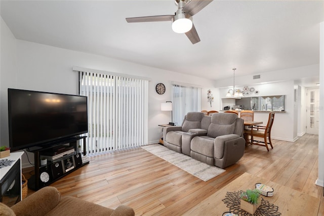 3815 NE 17th Street Cir, Ocala, FL 34470 - living room with a ceiling fan, light wood-type flooring, and baseboards