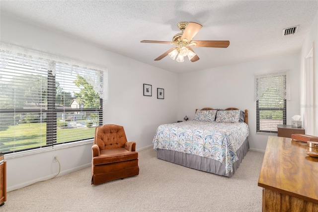 3815 NE 17th Street Cir, Ocala, FL 34470 - bedroom with carpet, ceiling fan, baseboards, and a textured ceiling