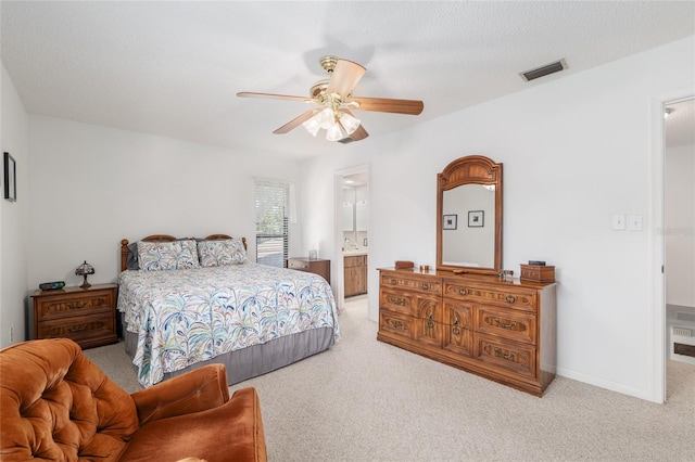 3815 NE 17th Street Cir, Ocala, FL 34470 - bedroom with carpet flooring, ceiling fan, and ensuite bathroom