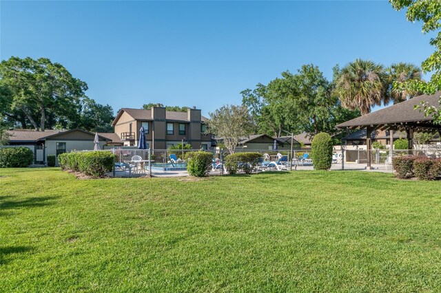 3815 NE 17th Street Cir, Ocala, FL 34470 - view of yard with a gazebo and a community pool